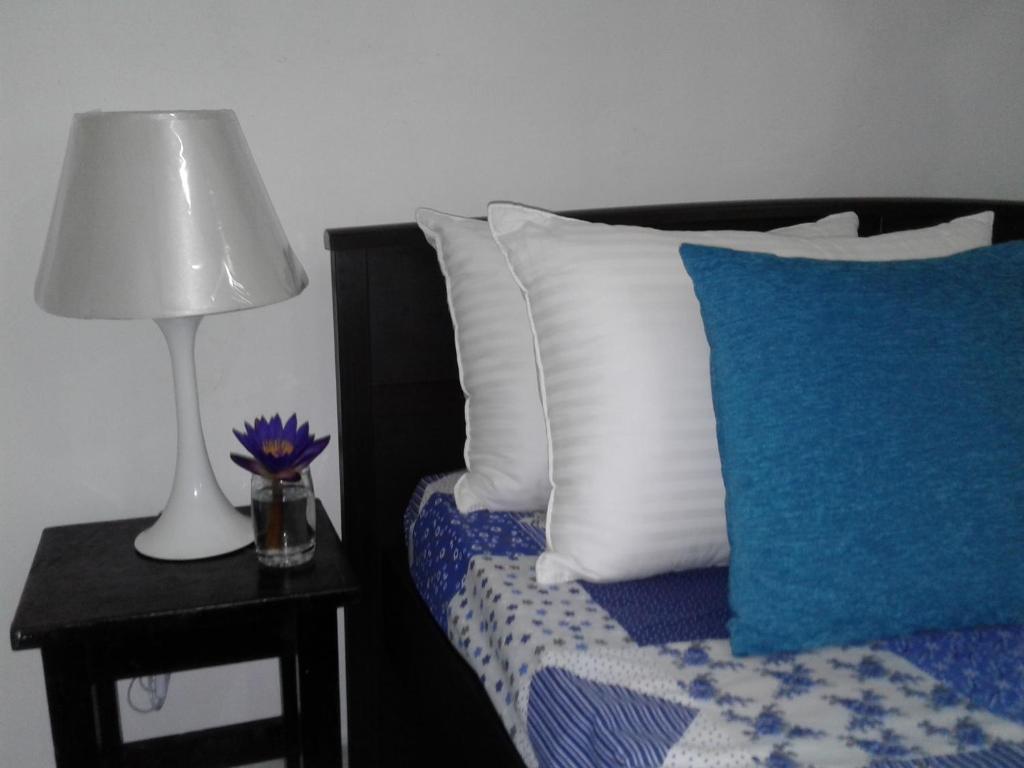 Postel nebo postele na pokoji v ubytování Anusha Apartment 15 Homestay