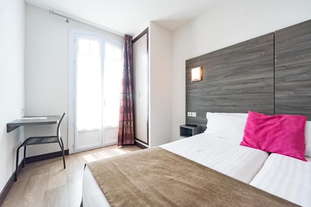 Postel nebo postele na pokoji v ubytování Hotel Le 21