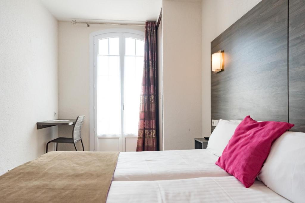 Postel nebo postele na pokoji v ubytování Hotel Le 21