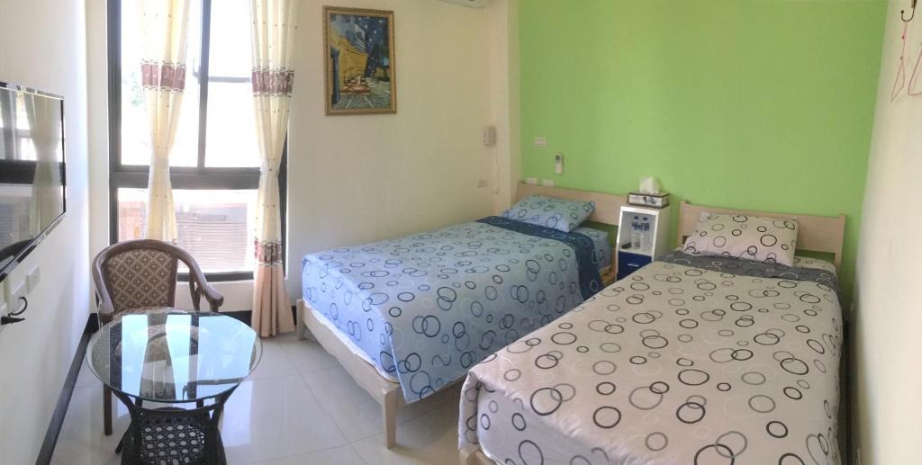 Postel nebo postele na pokoji v ubytování Starry Sky Inn