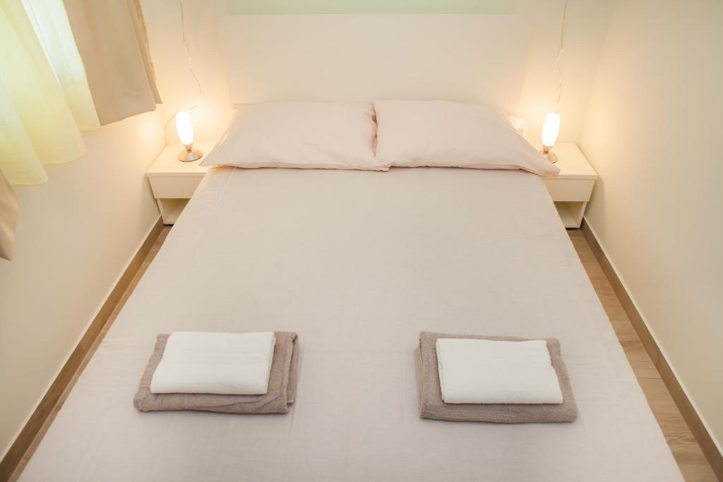 Postel nebo postele na pokoji v ubytování Apartments Villa Matea