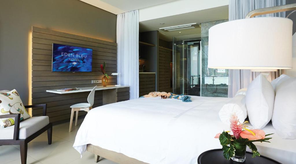 Postel nebo postele na pokoji v ubytování Eden Bleu Hotel