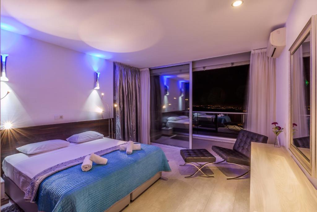Postel nebo postele na pokoji v ubytování Oceania & Panorama Villas