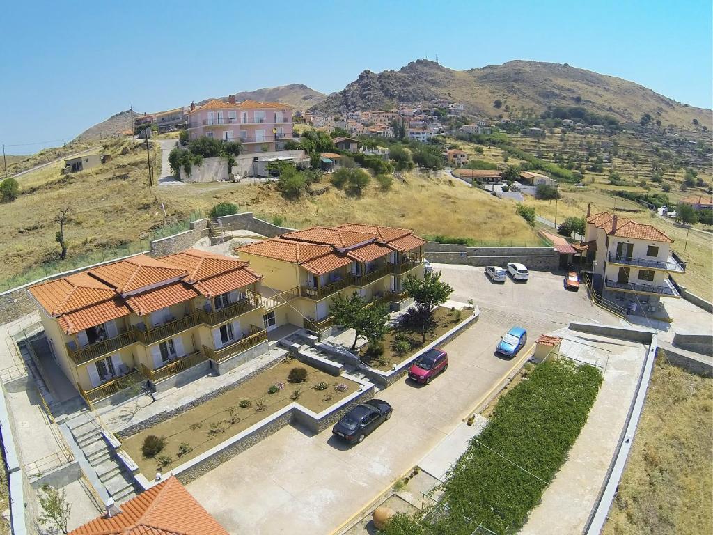 an overhead view of a building with a parking lot at Panorama Plati in Platy