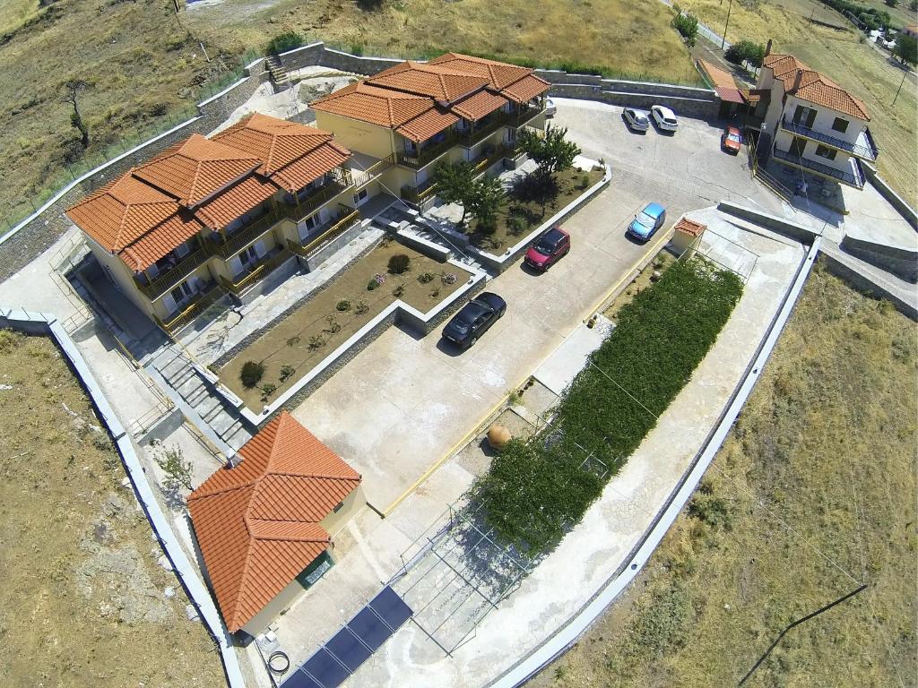 an overhead view of a house with a parking lot at Panorama Plati in Platy