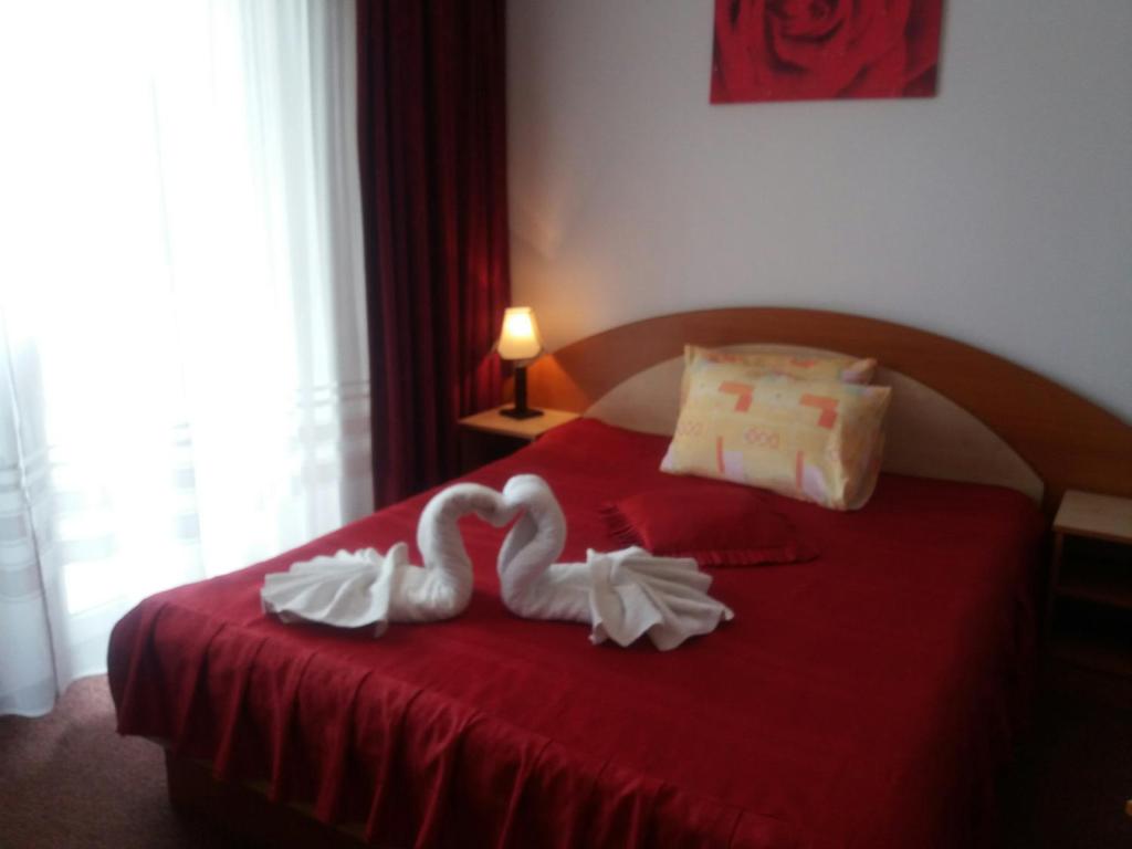 Postel nebo postele na pokoji v ubytování Vila Queen