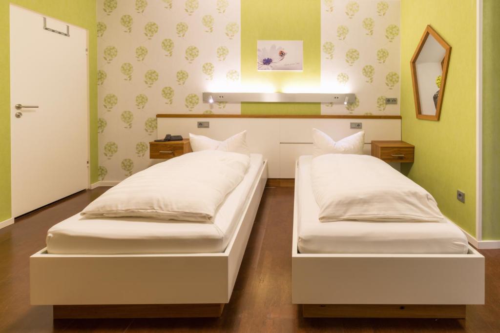 Postel nebo postele na pokoji v ubytování Hotel Luisen Mühle