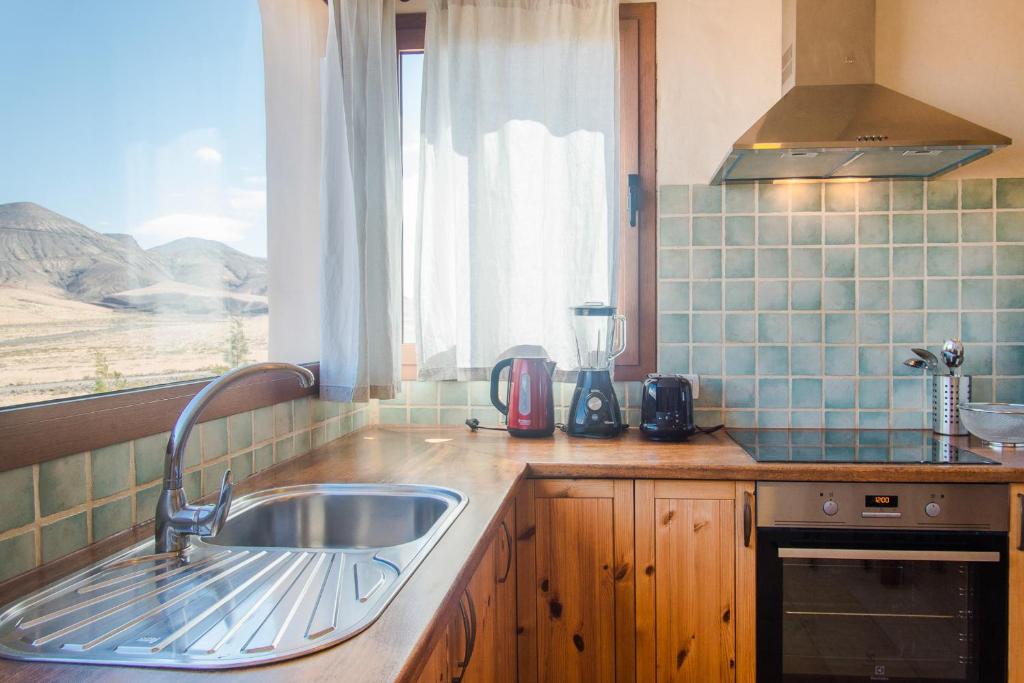 Kuchyň nebo kuchyňský kout v ubytování Villa Upupa