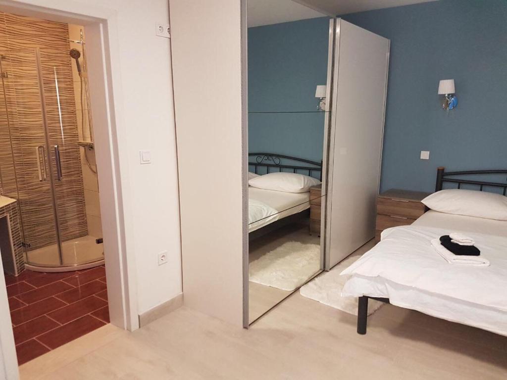 Postel nebo postele na pokoji v ubytování Villa Drinka Apartments