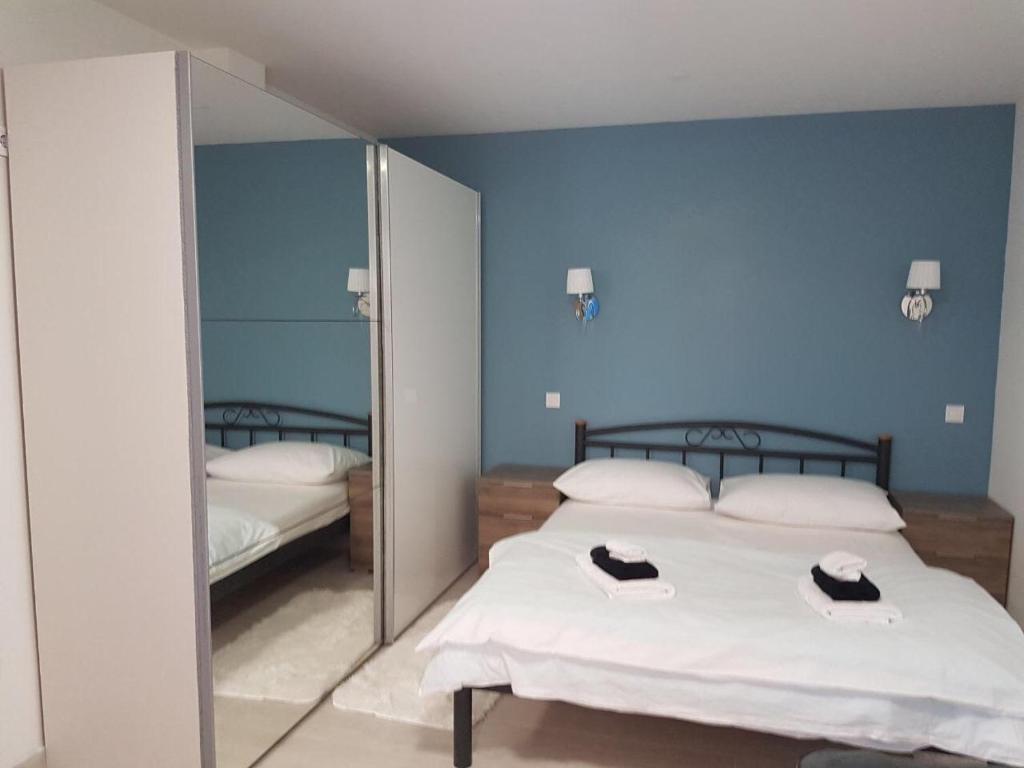 Postel nebo postele na pokoji v ubytování Villa Drinka Apartments