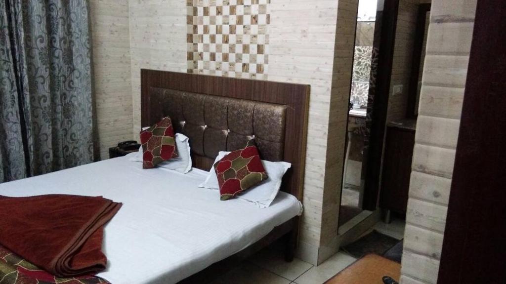 Postel nebo postele na pokoji v ubytování Hotel Grand