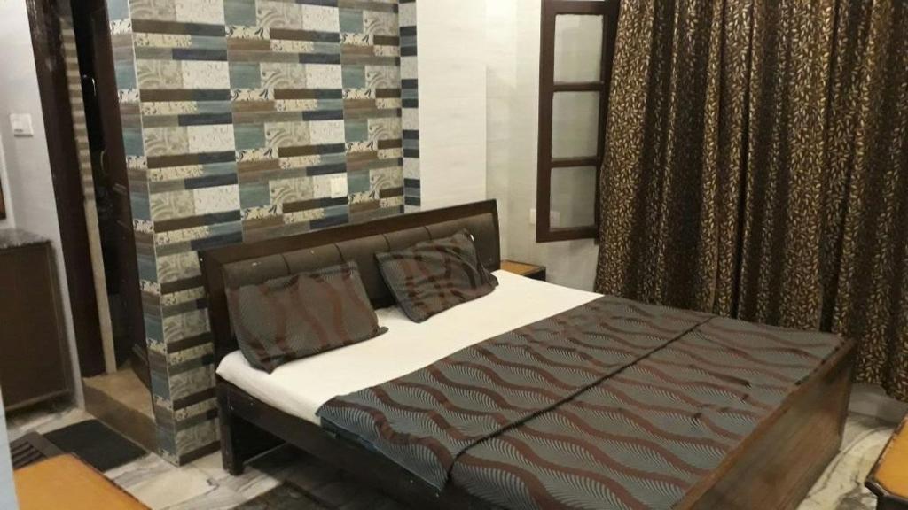 Postel nebo postele na pokoji v ubytování Hotel Grand