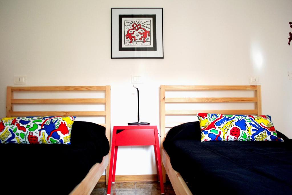 Postel nebo postele na pokoji v ubytování Stazione22 B&B