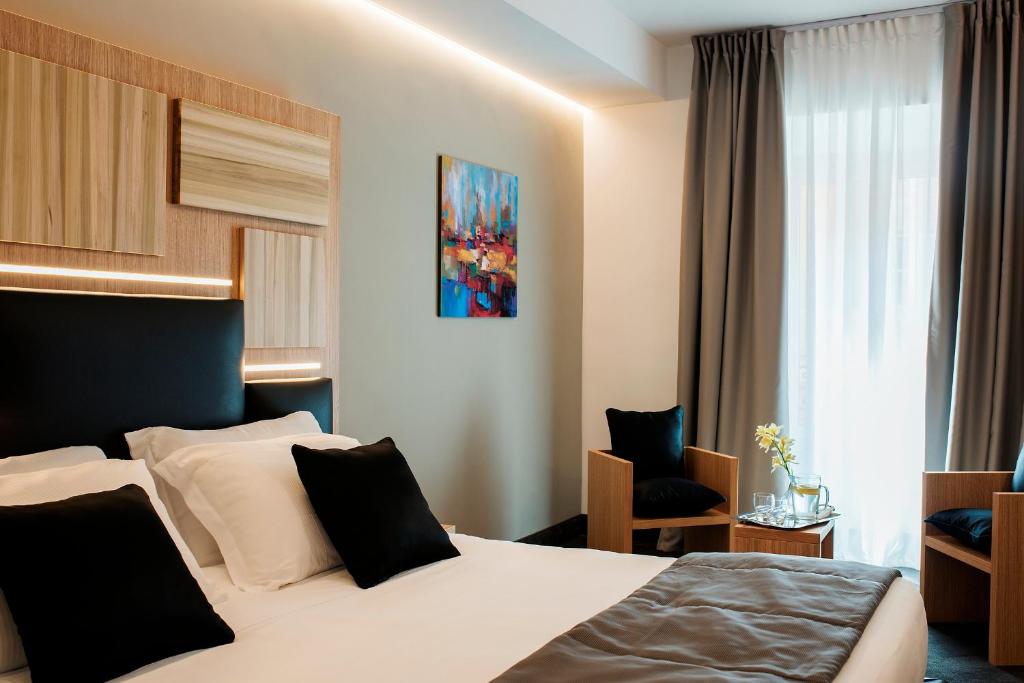 Postel nebo postele na pokoji v ubytování Trevi Collection Hotel - Gruppo Trevi Hotels