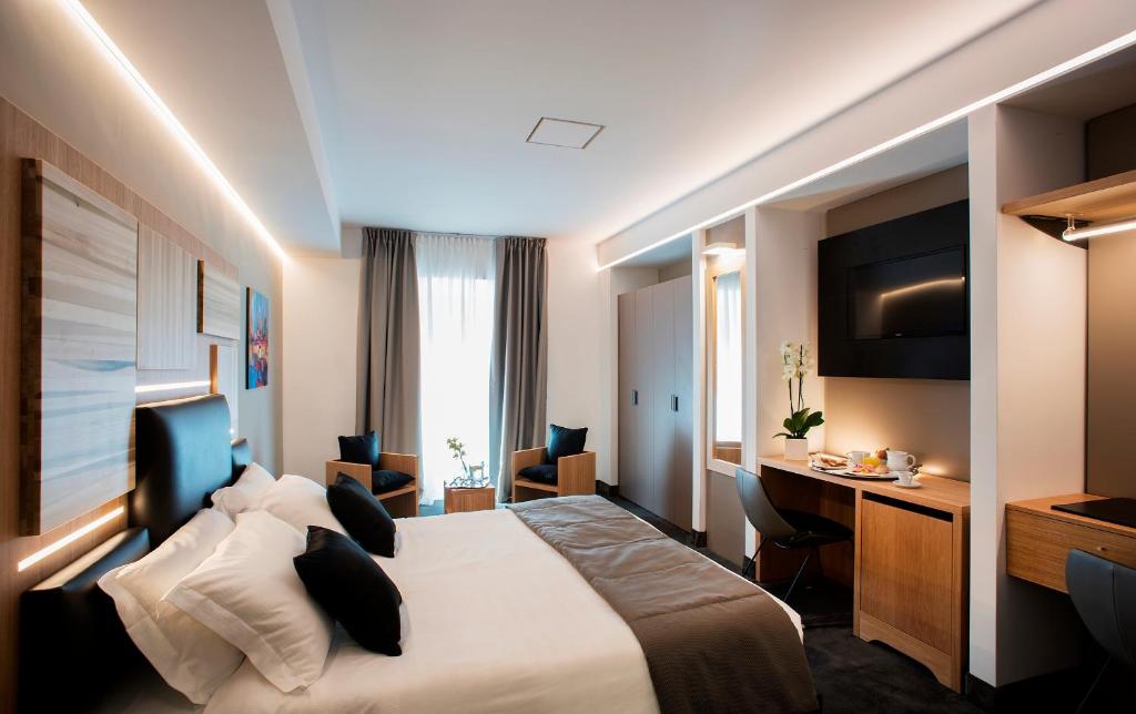 Postel nebo postele na pokoji v ubytování Trevi Collection Hotel - Gruppo Trevi Hotels