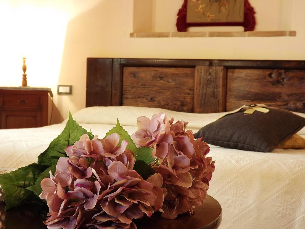 Postel nebo postele na pokoji v ubytování Cortona Resort-Le Terre Dei Cavalieri