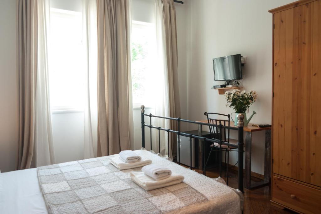 Postel nebo postele na pokoji v ubytování Indigo Inn Rooms