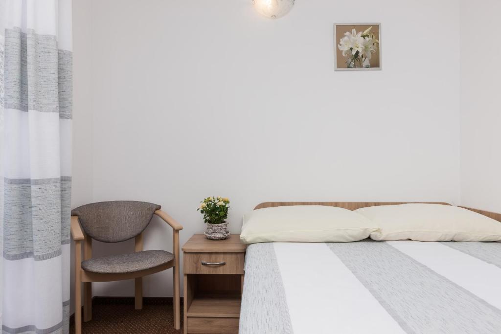Postel nebo postele na pokoji v ubytování Dom Gościnny Oskar