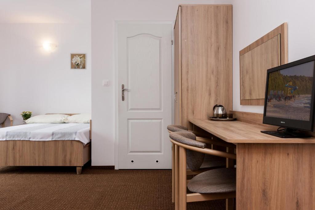 Postel nebo postele na pokoji v ubytování Dom Gościnny Oskar