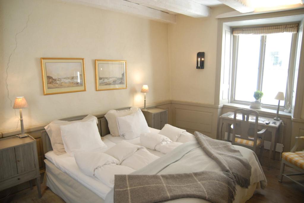 Postel nebo postele na pokoji v ubytování Hotel Sven Vintappare