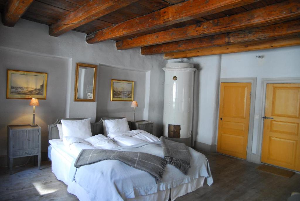 Postel nebo postele na pokoji v ubytování Hotel Sven Vintappare