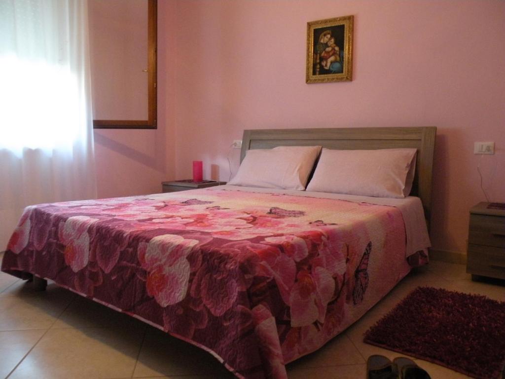 Postel nebo postele na pokoji v ubytování Casa Oriana