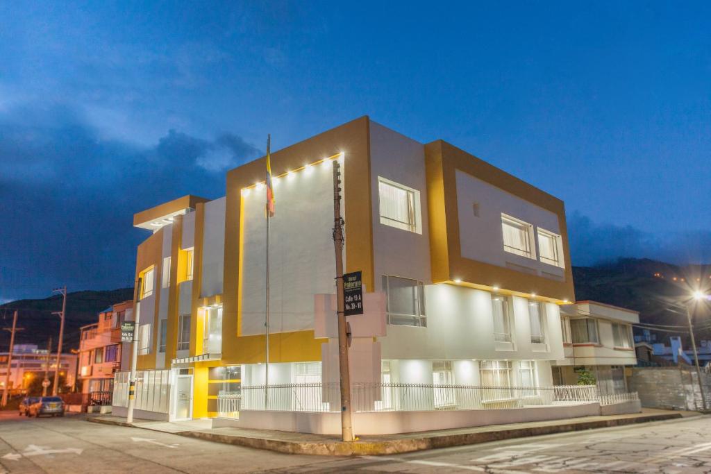 a building with lights on the side of it at Hotel Palermo Suite in Pasto