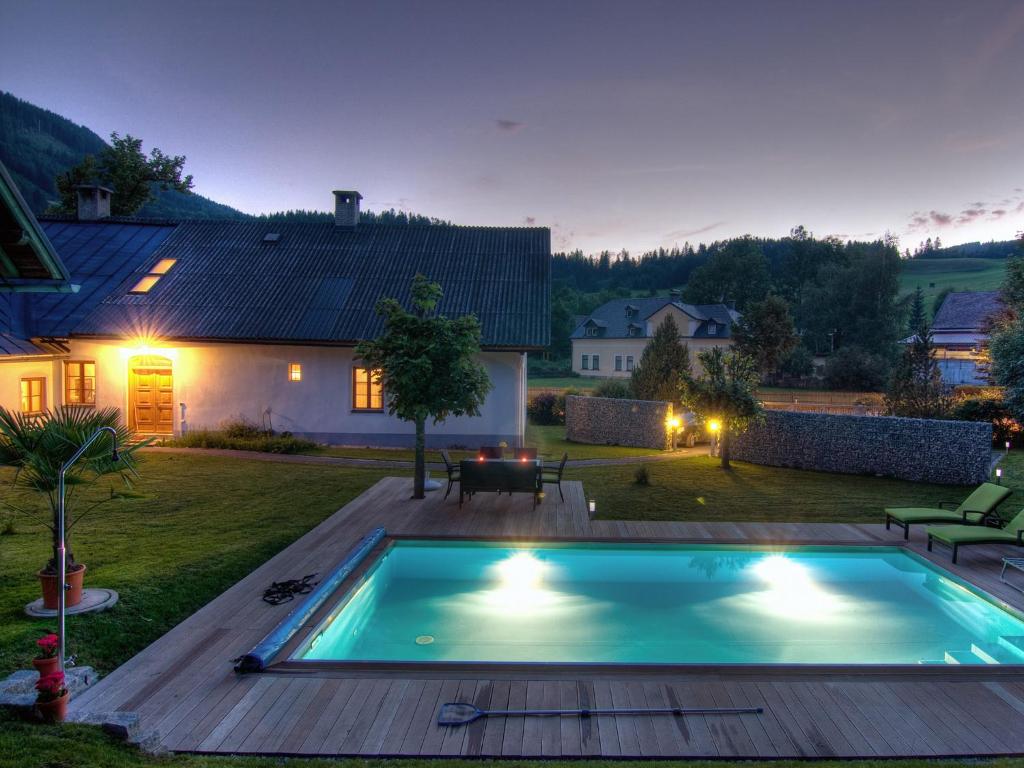 a swimming pool in the yard of a house at Ferienwohnung Mariazell in Mariazell
