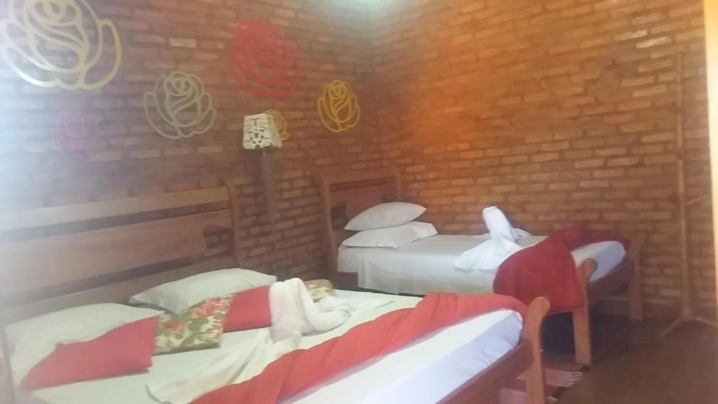 Postel nebo postele na pokoji v ubytování Chales Recanto das Seriemas