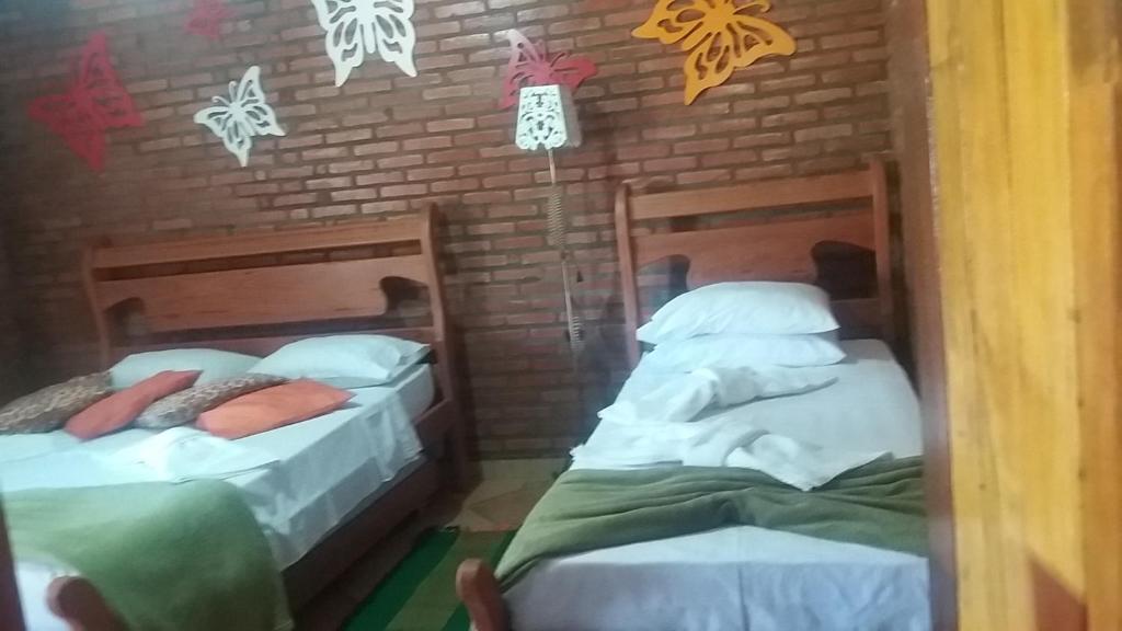 Postel nebo postele na pokoji v ubytování Chales Recanto das Seriemas