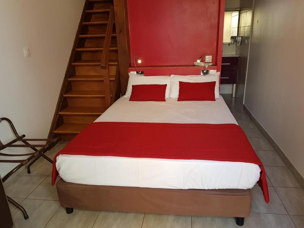 Postel nebo postele na pokoji v ubytování Hôtel Port Beach