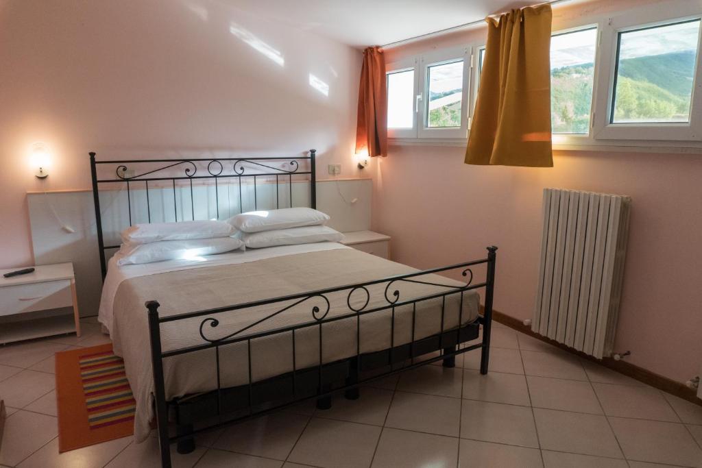 Postel nebo postele na pokoji v ubytování B&B Apartments Casa Sullavalle