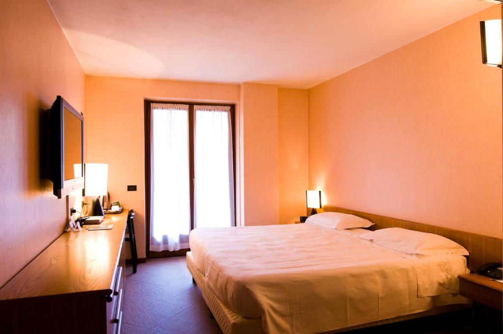 Posteľ alebo postele v izbe v ubytovaní Active Hotel