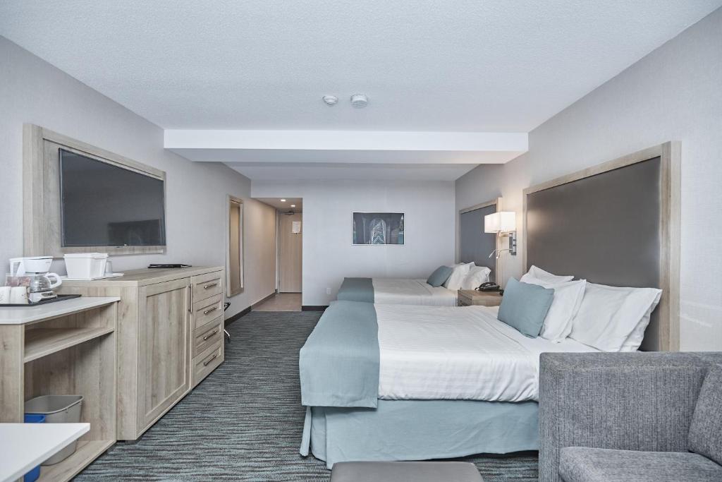 Postel nebo postele na pokoji v ubytování Vittoria Hotel & Suites