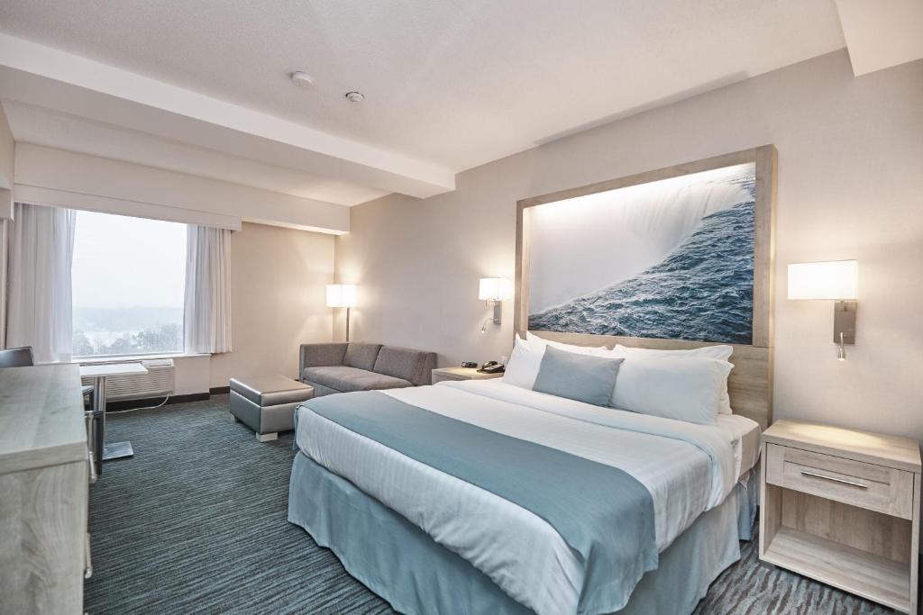 Postel nebo postele na pokoji v ubytování Vittoria Hotel & Suites