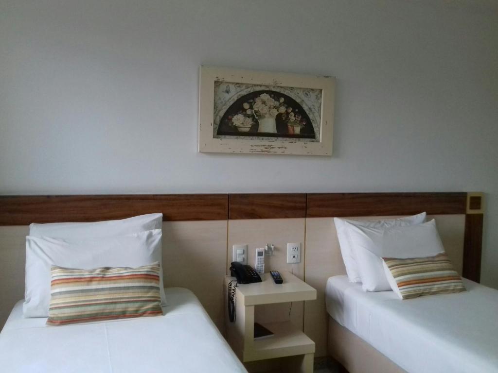 
Cama ou camas em um quarto em Pratti Hotel
