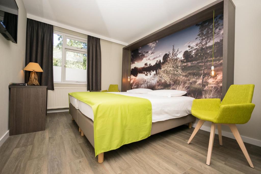 Postel nebo postele na pokoji v ubytování Hotel de Hoeve van Nunspeet