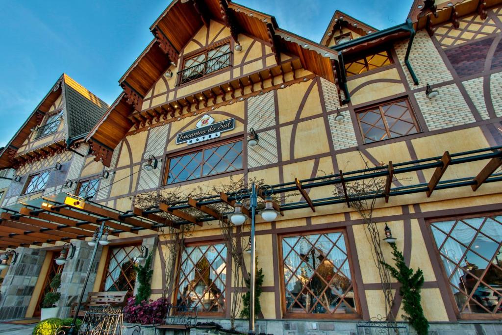 a large building with windows and awning at Life Hotel Infinity in Gramado
