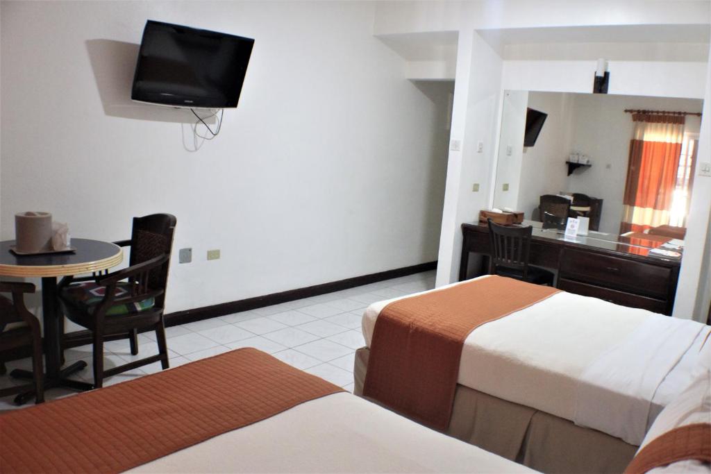 Postel nebo postele na pokoji v ubytování Altamont Court Hotel