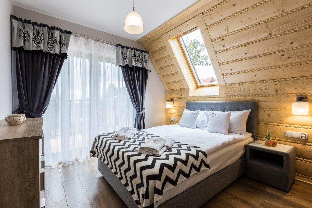 Posteľ alebo postele v izbe v ubytovaní Giewont Residence