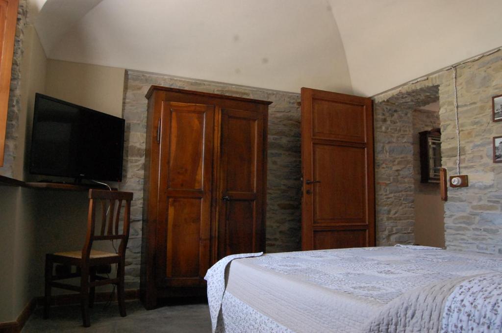 Posteľ alebo postele v izbe v ubytovaní Appartamenti Cenni - Relais su Lago