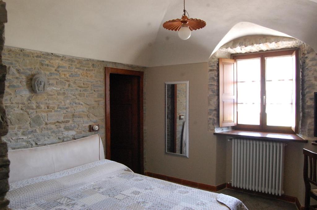 Posteľ alebo postele v izbe v ubytovaní Appartamenti Cenni - Relais su Lago