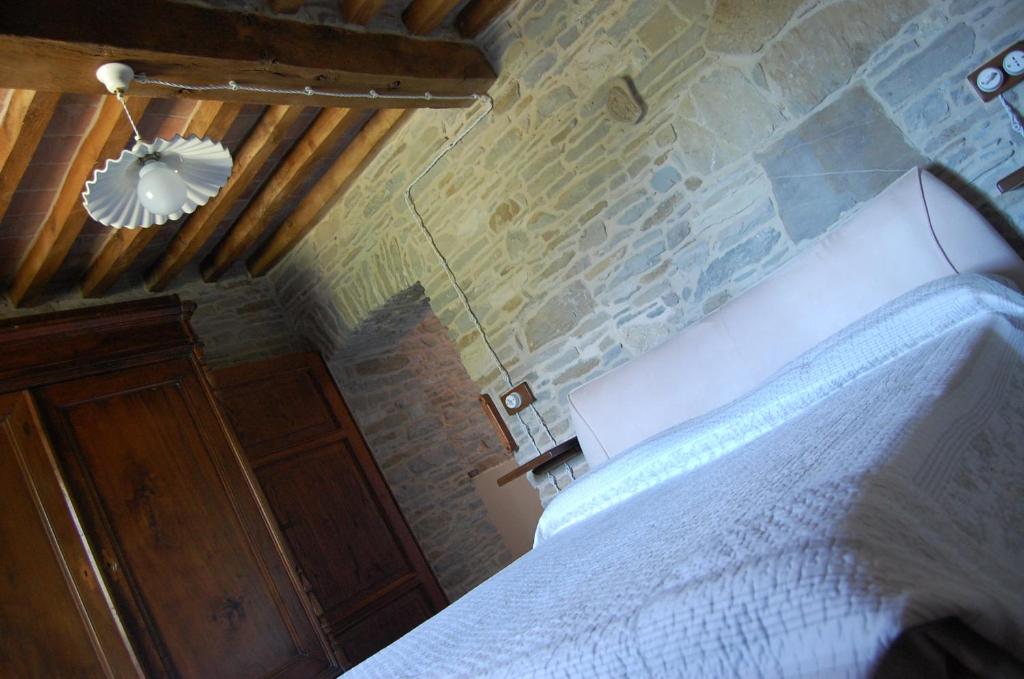 Posteľ alebo postele v izbe v ubytovaní Appartamenti Cenni - Relais su Lago