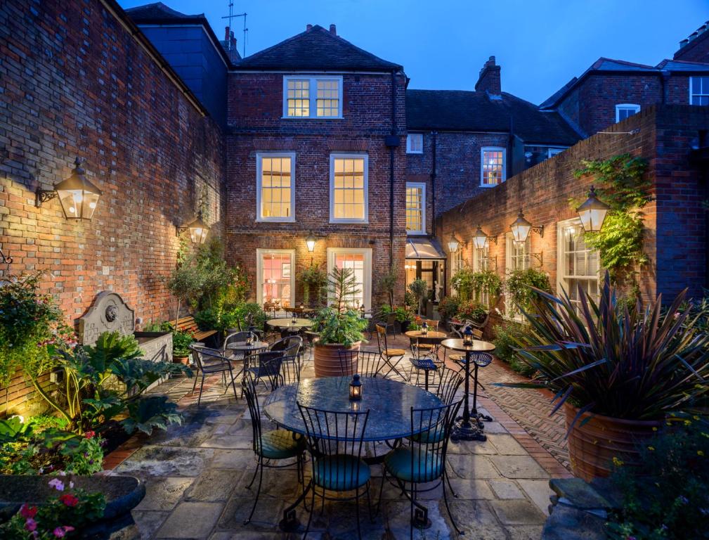 a courtyard with tables and chairs in front of a building at Ye Spotted Dogge in Portsmouth