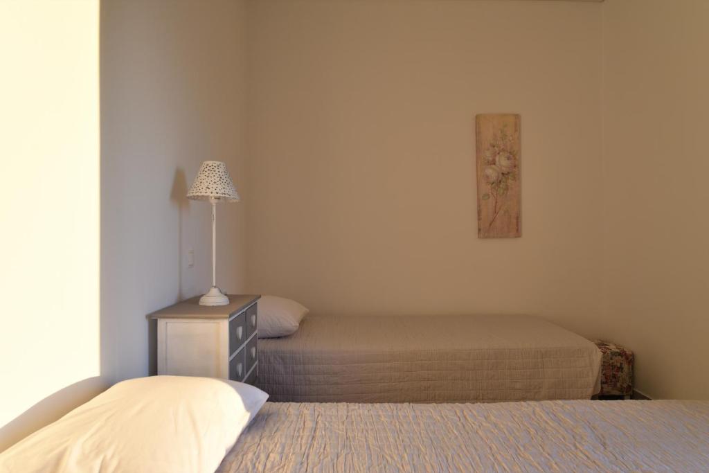 Posteľ alebo postele v izbe v ubytovaní Olive Tree House in Parikia