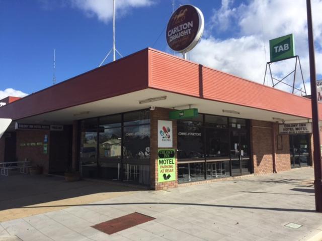 a fast food restaurant with a sign on top of it at Colony Inn Hotel in Jerilderie