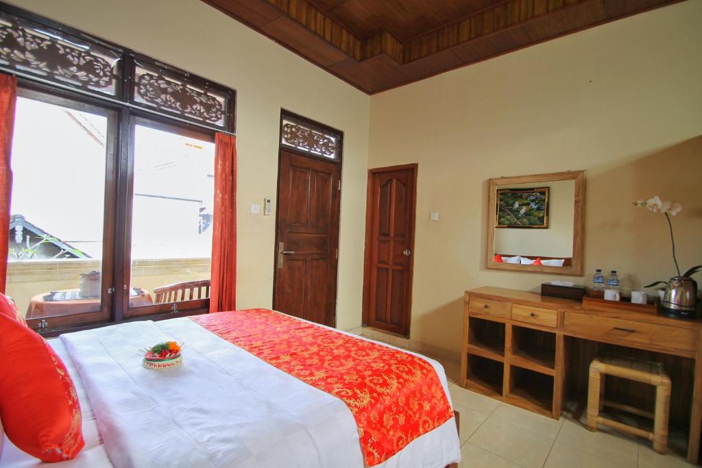 Postel nebo postele na pokoji v ubytování Narada House Ubud