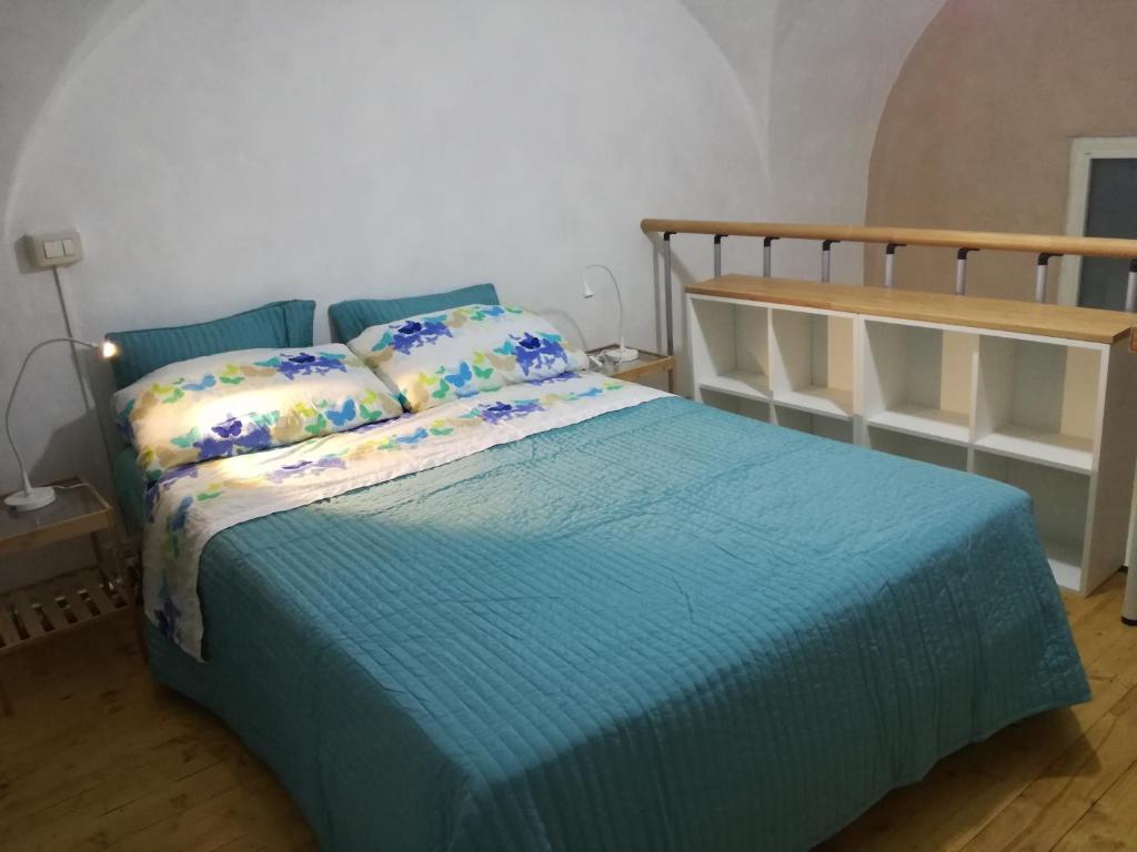 A bed or beds in a room at Casa della Palma
