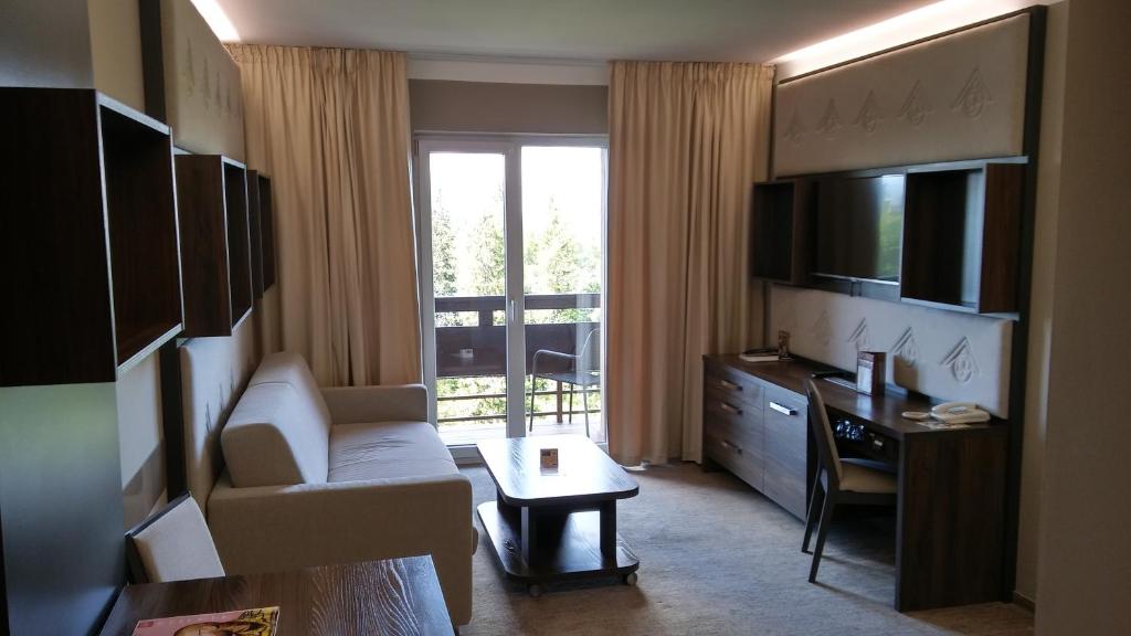 TV a/nebo společenská místnost v ubytování Hotel Patria