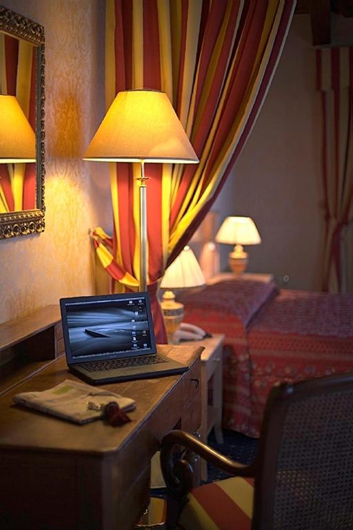 TV a/nebo společenská místnost v ubytování Hotel Orologio